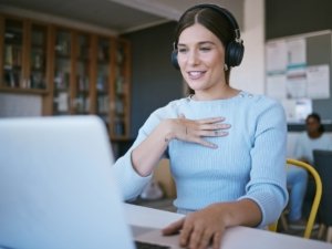 Video call, presentation and student with laptop and headphones talking in virtual class discussion