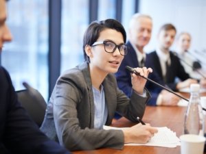 Young Businesswoman Speaking at Conference