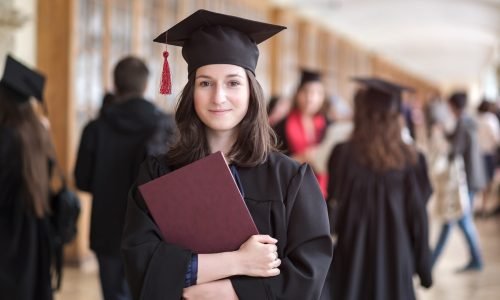 Happy caucasian woman on her graduation day at University.