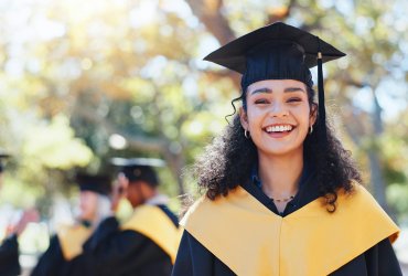 Happy woman, portrait and graduation with hat in nature for outdoor ceremony, scholarship or qualif