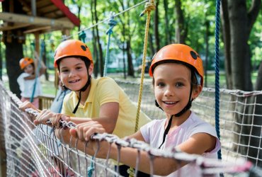 selective focus of happy kids in adventure park