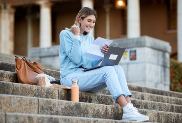 Wow, success or excited college student with news, results or report feedback at university campus